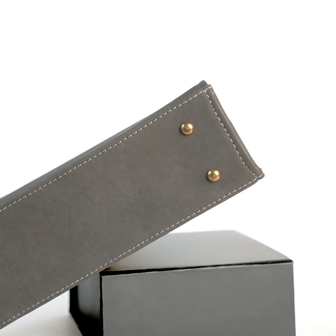 Stitching and gold base studs on a Malang bag
