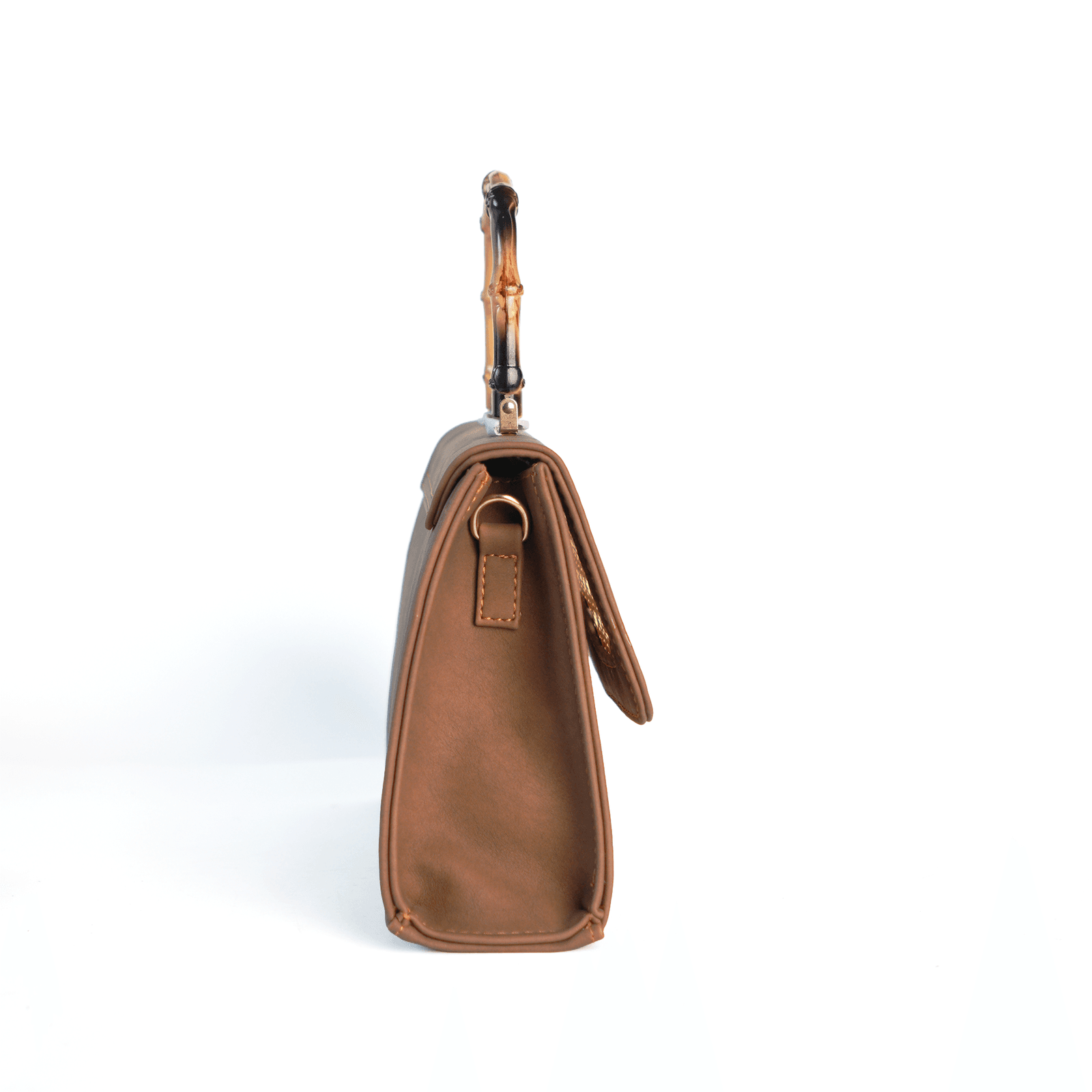Brown Taaq bag side profile showing depth and strap ring